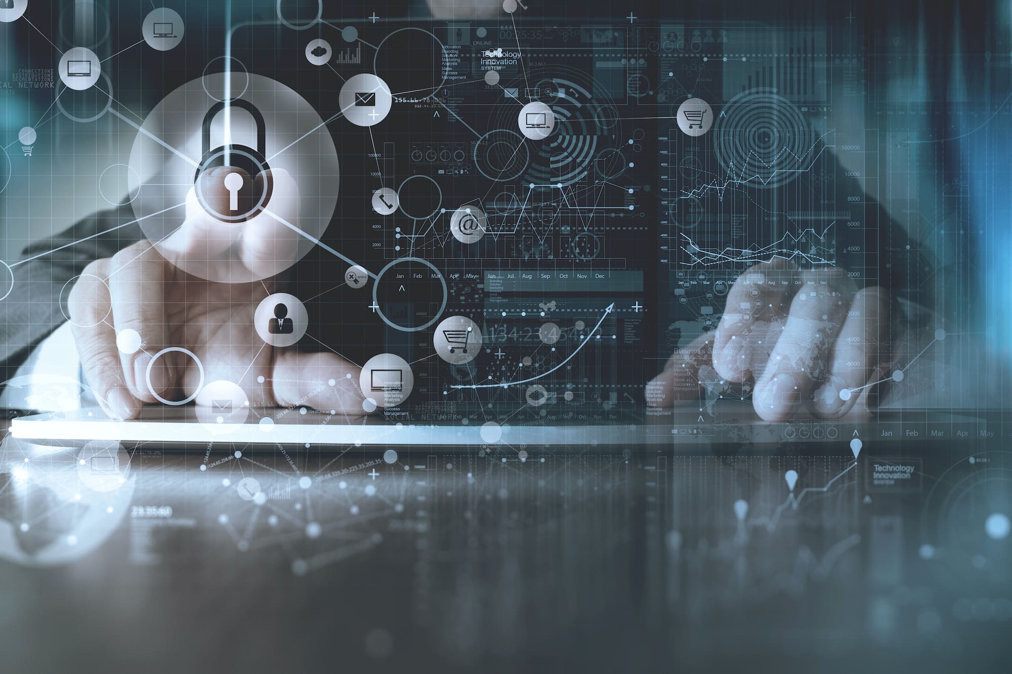 Person typing on keyboard and using touchscreen with security icons